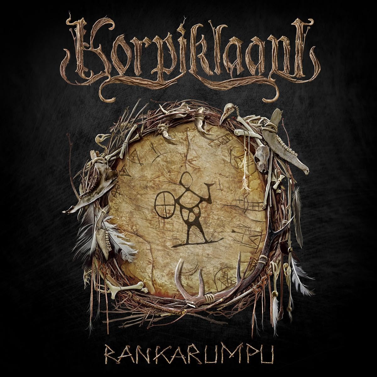 Korpiklaani album cover: drum with antlers, feathers, and band logo.