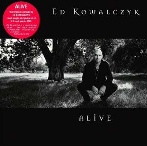 CD cover for Ed Kowalczyk’s “Alive” featuring a crouching man in a field.