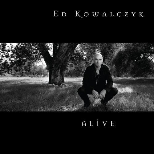 Black and white album cover featuring Ed Kowalczyk crouching in a field.
