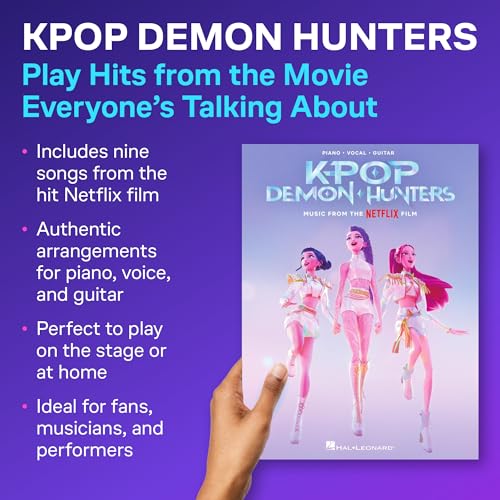 A hand holds a KPop Demon Hunters music book featuring three animated female characters.