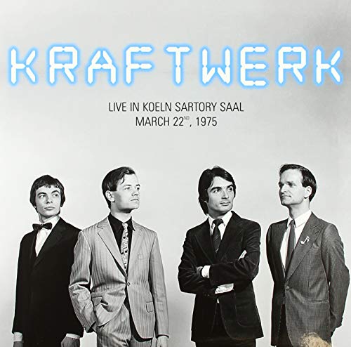 Kraftwerk album cover featuring four men in suits, black and white photo.