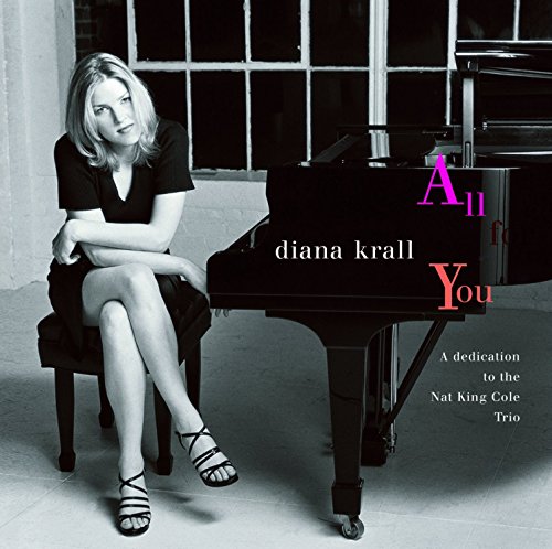 Diana Krall seated by a grand piano, album cover for "All For You.