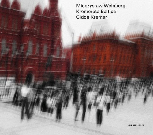CD cover with blurred red building and indistinct figures.