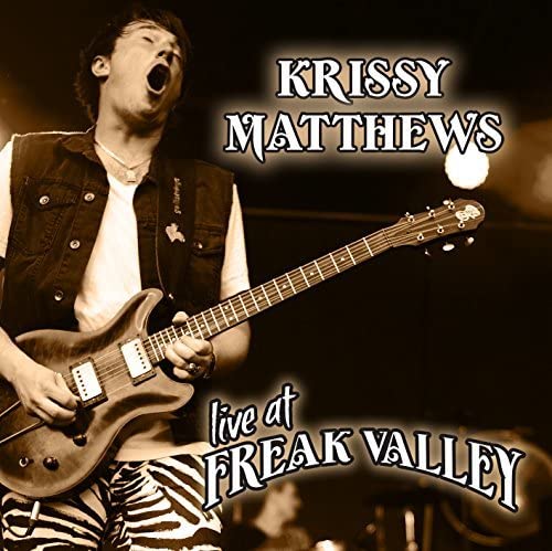 Krissy Matthews playing electric guitar live at Freak Valley, CD cover.