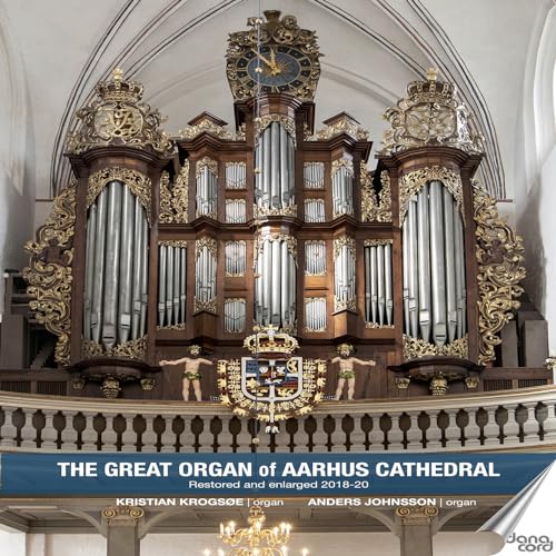 Large, ornate pipe organ with clock, inside Aarhus Cathedral.
