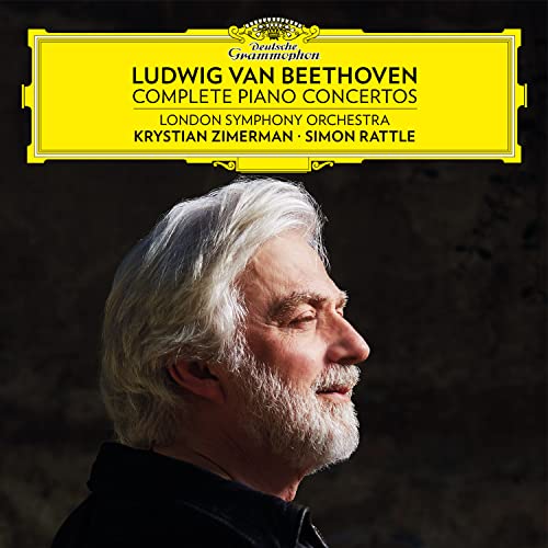 Profile portrait of Krystian Zimerman against a dark background with Deutsche Grammophon branding above.