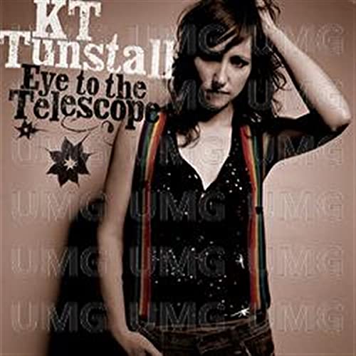 KT Tunstall album cover featuring the artist wearing rainbow suspenders against a brown background.