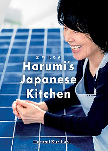 Smiling woman in an apron leaning on a blue tiled counter, book cover image.