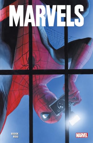 Spider-Man hangs upside down behind a window, holding a camera with a flash.