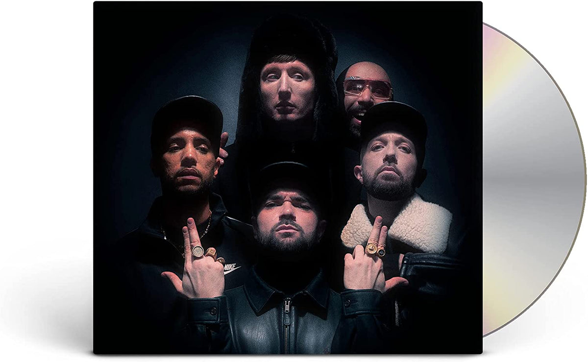 "CD case with five men on the cover, partially obscuring a silver CD."