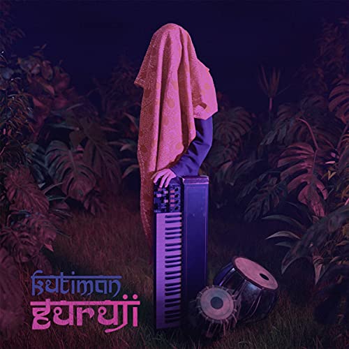 Person draped in a pink cloth playing a keyboard in a purple forest.