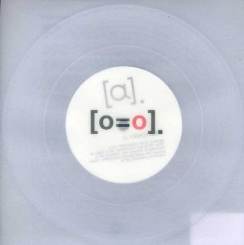 Clear seven-inch vinyl record with a white center label featuring black and red text.