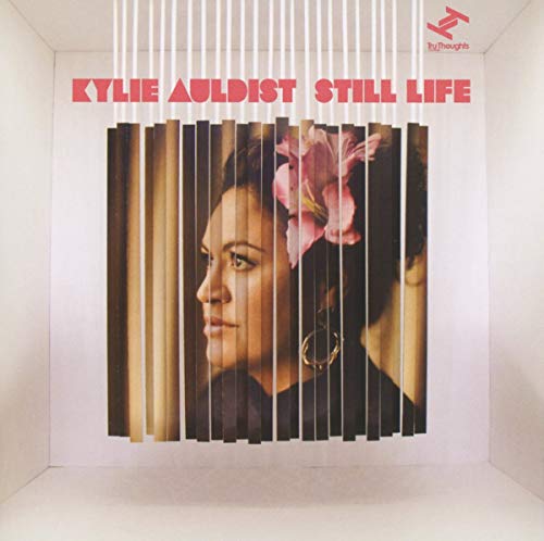 CD cover for Kylie Auldist’s “Still Life”, portrait behind bars.