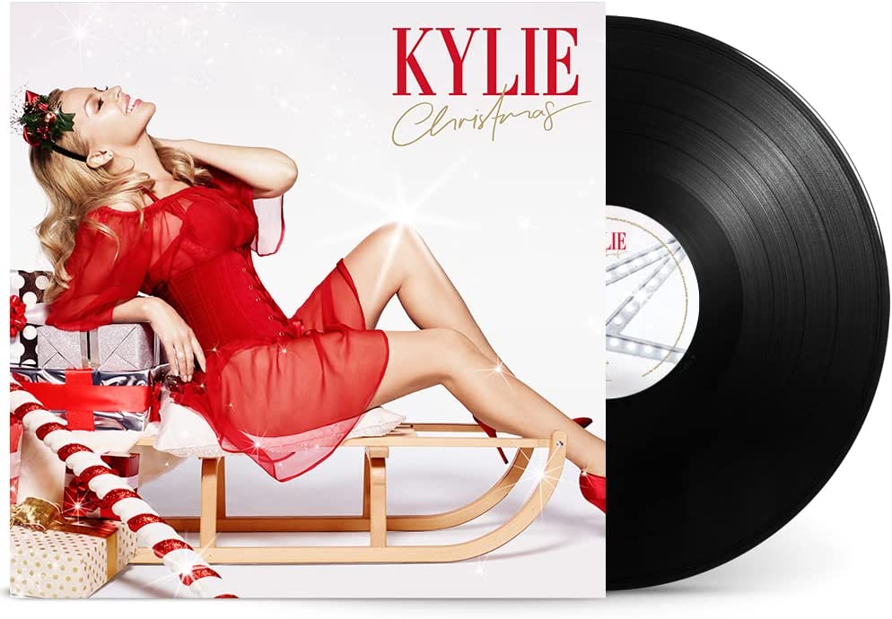 "Black vinyl record with Kylie Minogue album cover featuring Kylie in a red dress."