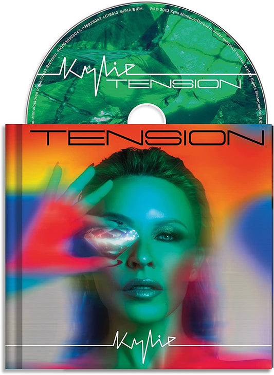 Kylie Minogue “Tension” deluxe CD cover with abstract art and portrait.