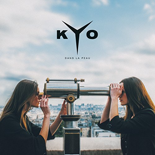 CD cover with two people looking through a vintage telescope at a city.
