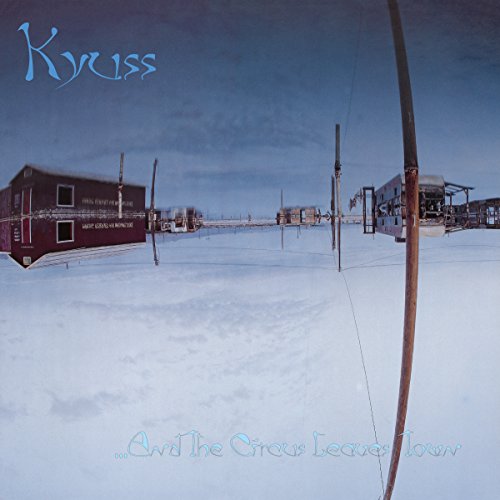 Kyuss album cover: desolate landscape with small buildings in the snow.