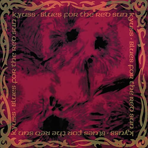 Album cover featuring a red abstract background with a tribal border and repeating text.