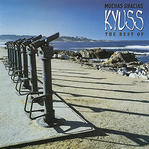 Kyuss album cover: beach, binoculars, and blue sky with text overlay.