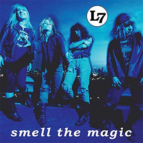 Album cover with four band members posed, blue-toned image with white text.