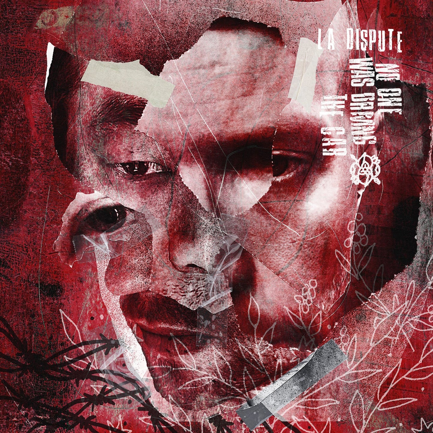 A collage of a person's face in red tones with tape and floral line art.