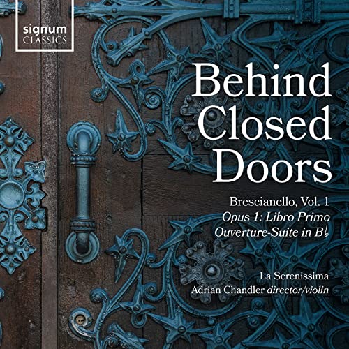 CD cover with ornate blue metalwork on a dark wood background.