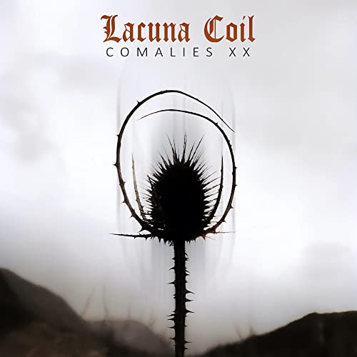 Lacuna Coil album cover: thorny plant silhouette against a misty landscape.