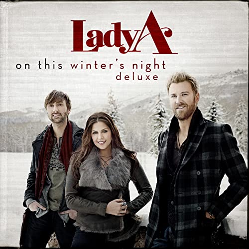 Lady A album cover featuring three people in winter clothing.