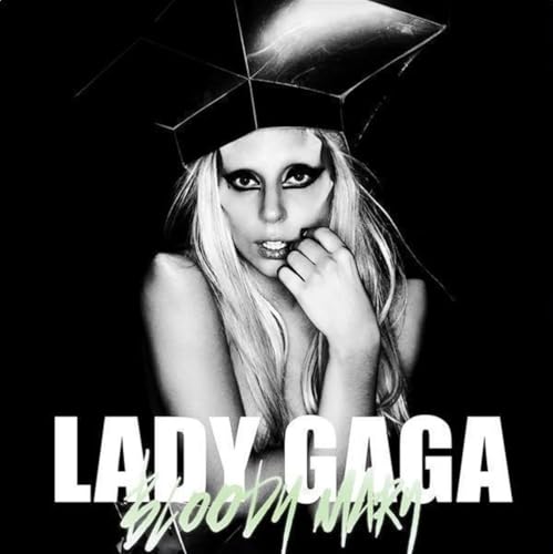 Black and white portrait of Lady Gaga with geometric headpiece.