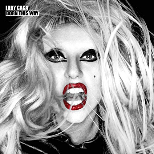 Black and white portrait of Lady Gaga with blonde hair and bright red lips.