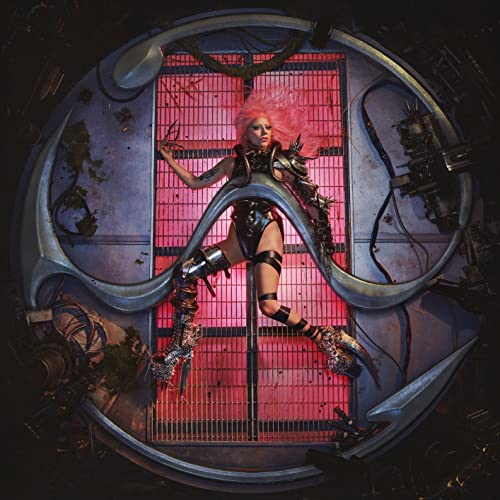 LadyLC Lady Gaga with pink hair in metallic armor inside a circular futuristic structure.