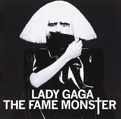 Black and white portrait of Lady Gaga with blonde bob hair covering her face.
