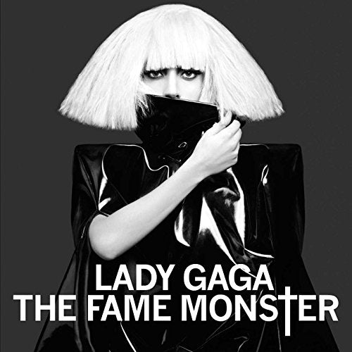 Black and white album cover of Lady Gaga in dramatic makeup and attire.