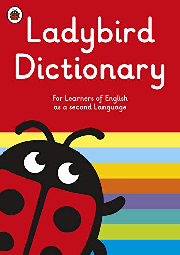 Red "Ladybird Dictionary" cover with a cartoon ladybug and rainbow stripes.