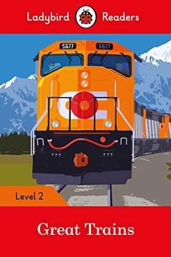 Orange and black train engine with mountains in the background.