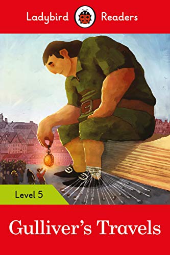 Book cover: giant Gulliver examining a tiny figure in a town.