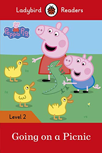 Peppa Pig and George with yellow ducklings in a green field.
