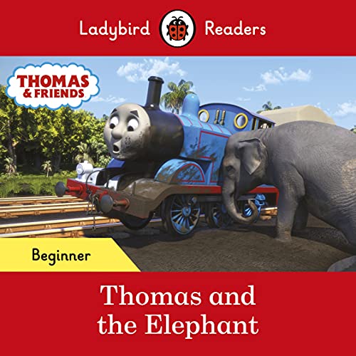 Blue Thomas the Tank Engine next to a gray elephant on tracks.
