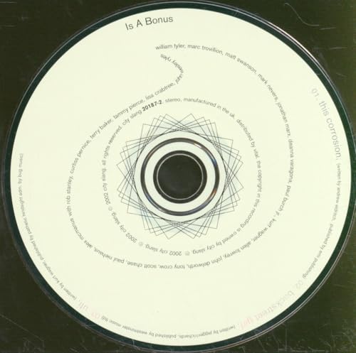 CD with white label and geometric design, text around the edge.