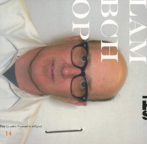 CD cover featuring a close-up portrait of a man with glasses.