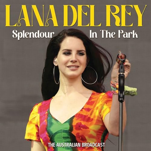 Lana Del Rey wearing a colorful dress and hoop earrings holding a microphone.