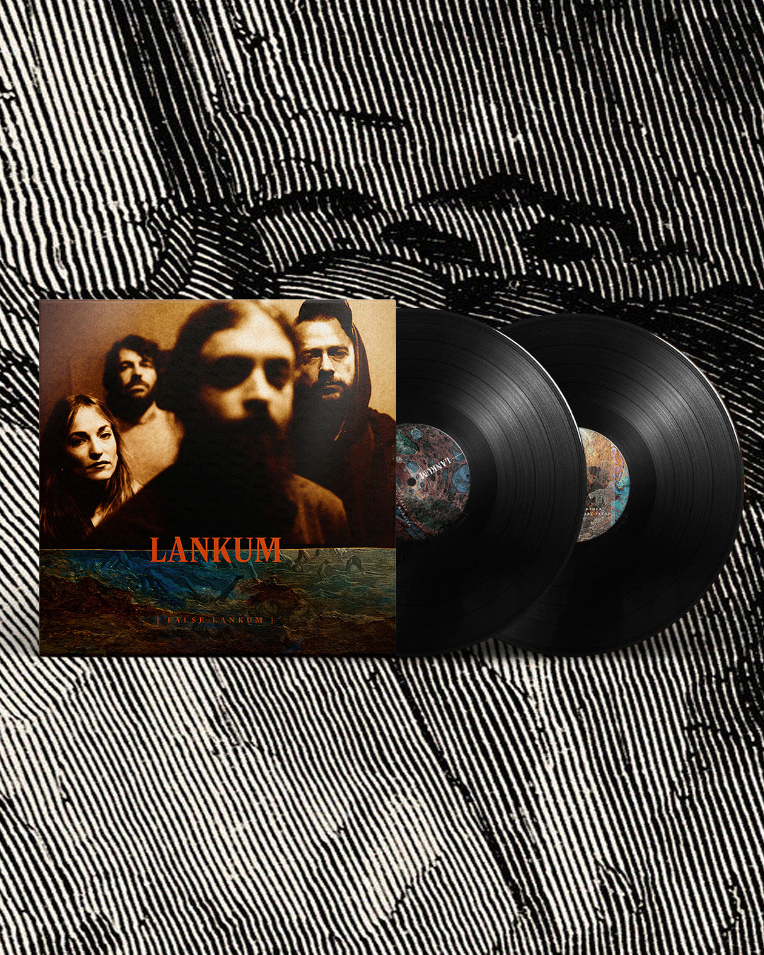"Black vinyl records with album cover featuring three people and 'Lankum' in orange text."