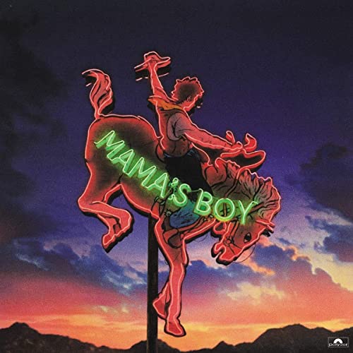 Neon sign of a cowboy on a horse against a sunset sky.