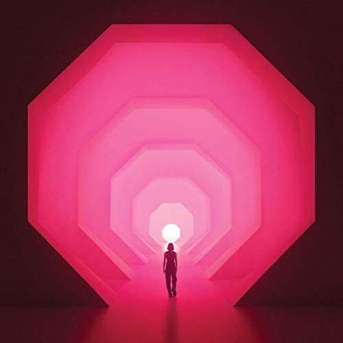 The image depicts a person standing in a tunnel of pink octagons leading to a bright light. For accessibility purposes, a suitable alt text could be: "Album cover featuring a person in a pink octagonal tunnel."