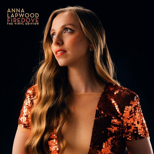 Anna Lapwood with long blonde hair wearing a sequined orange dress against black background.