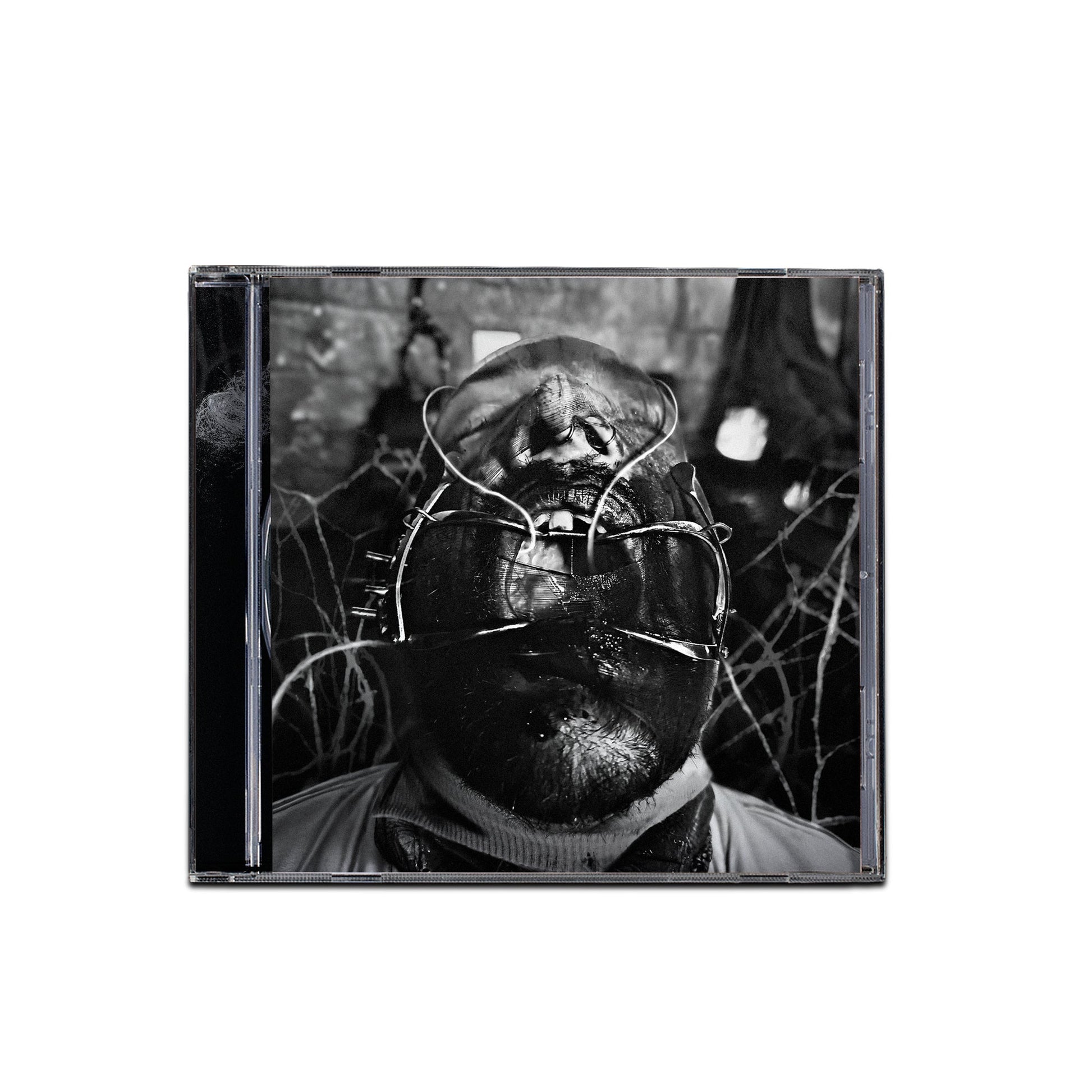 Black and white CD cover featuring a person with a metallic mask.