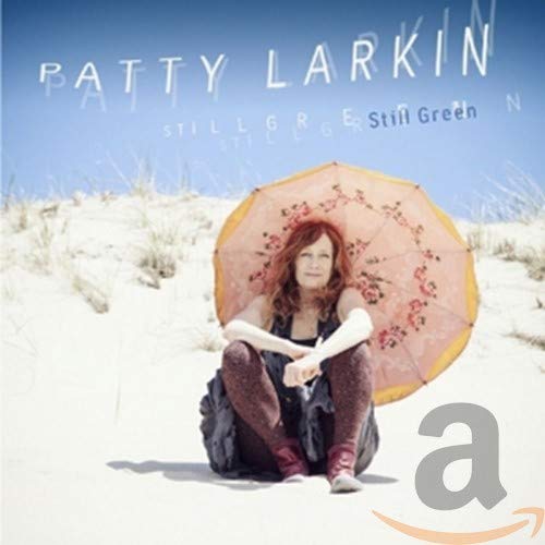 Patty Larkin album cover, woman with floral umbrella on a beach.