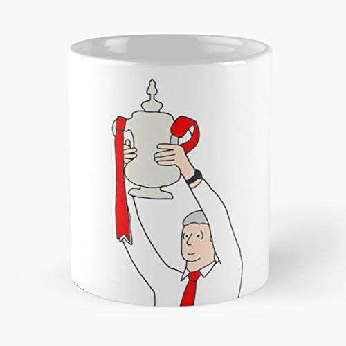 White mug with cartoon illustration of a man holding a trophy.