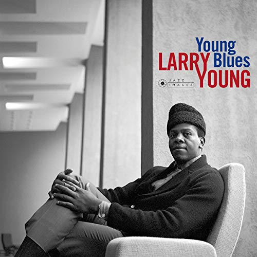Black and white portrait of Larry Young seated in a chair.
