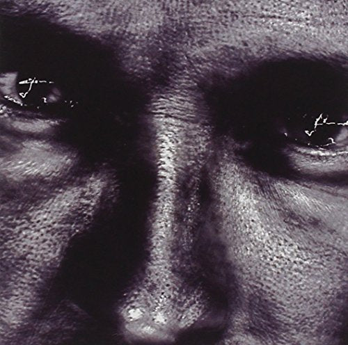 A close-up of a man's face, focusing on his eyes and nose.